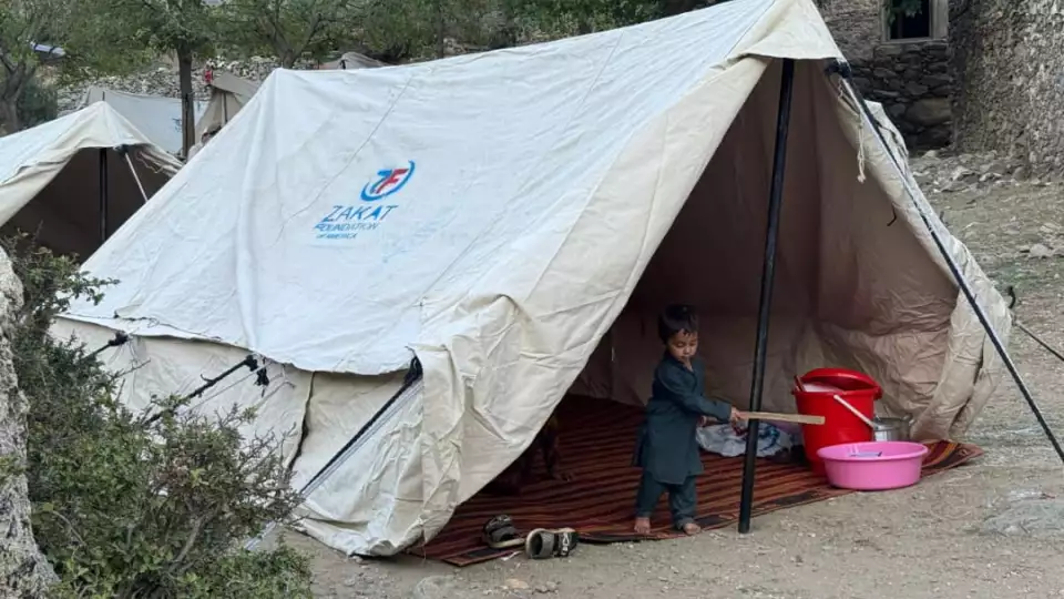 A little Afghan boy plays in the shelter tent as our teams continue aid distribution in Afghanistan.