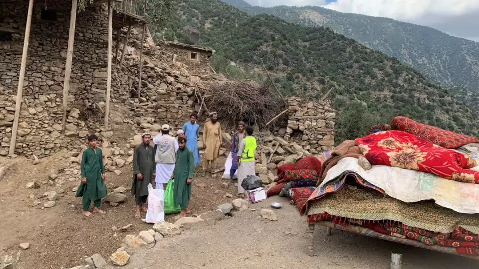 Families save their belonging from the rubble in the aftermath of the Afghanistan earthquake