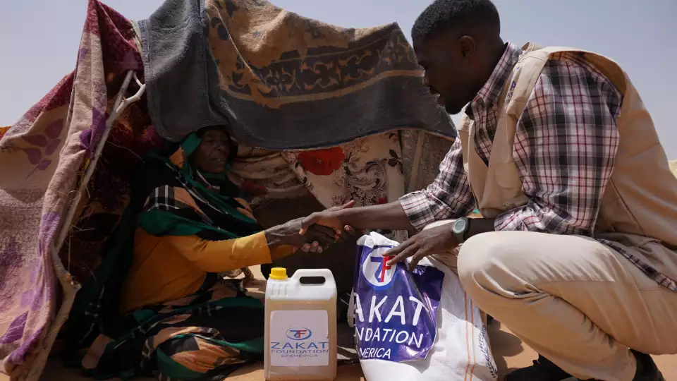 A tender moment holds more than words can express as our team delivers food to displaced Sudanese families